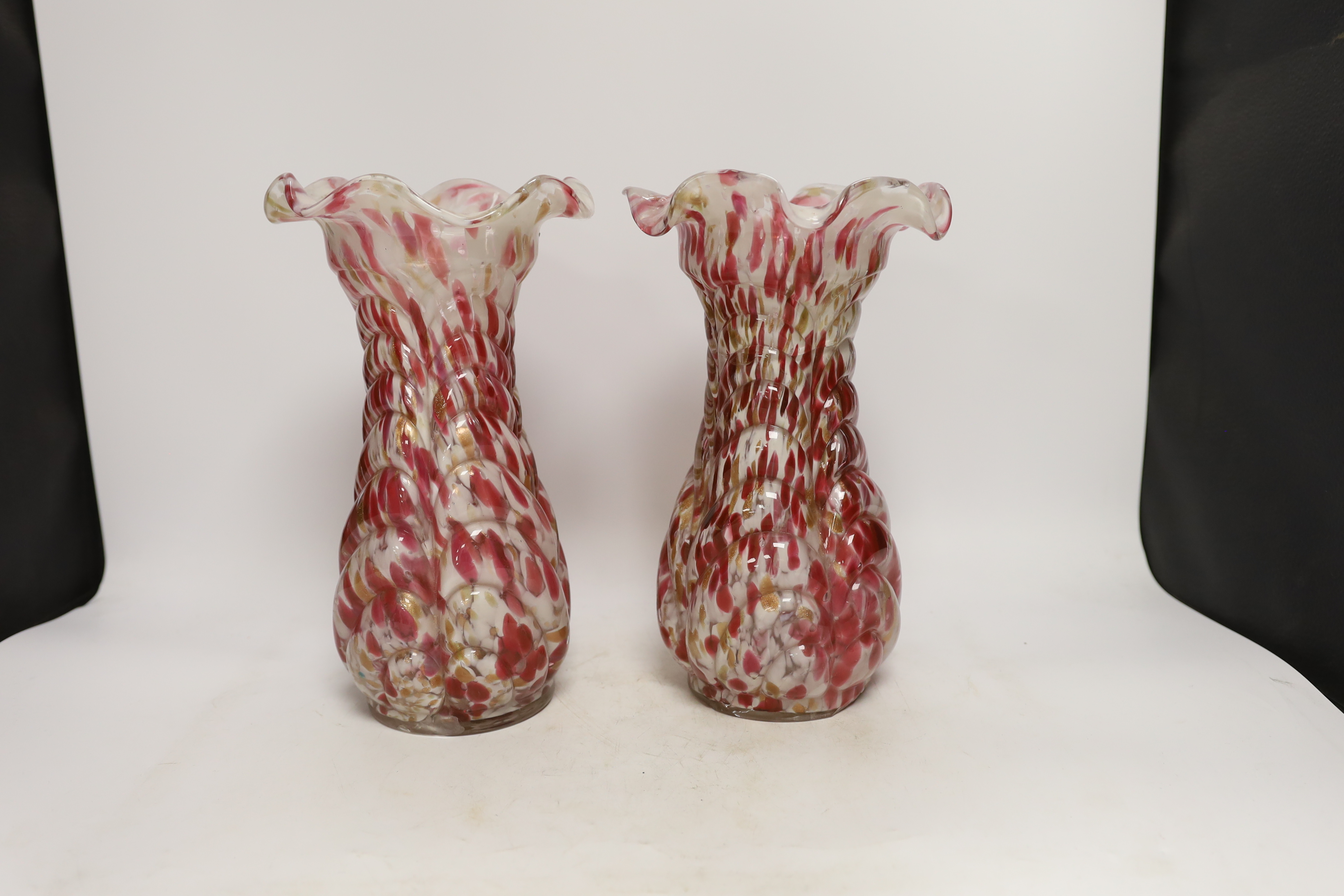 A pair of French red and white glass vases, marked Depose, 29cm high
